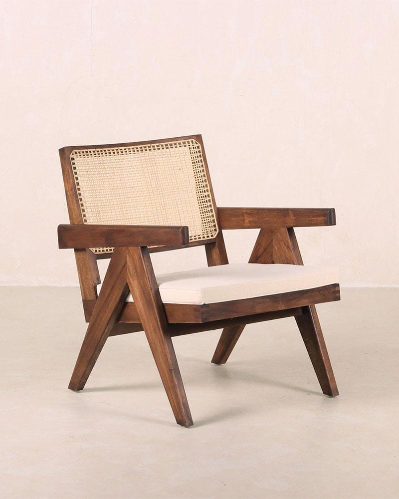 Easy lounge chair crafted in teak wood and handwoven rattan, ideal for Mediterranean interior design.