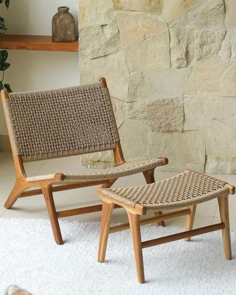 Woven rattan accent chair with matching ottoman, ideal for Mediterranean terraces and modern interiors